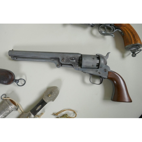 216 - Five replica pistols, including a French Lefaucheux pinfire revolver and a Colt model 1851, and two ... 