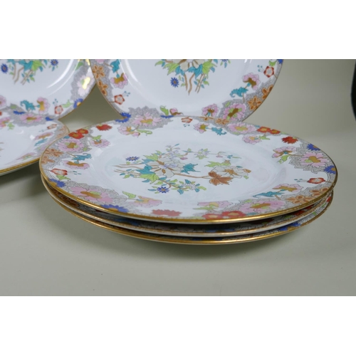 217 - A set of twelve Copeland Spode plates with polychrome and gilt floral design, 26cm diameter