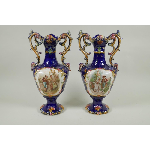 219 - A pair of blue ground Continental porcelain two handled vases with decorative panels depicting court... 