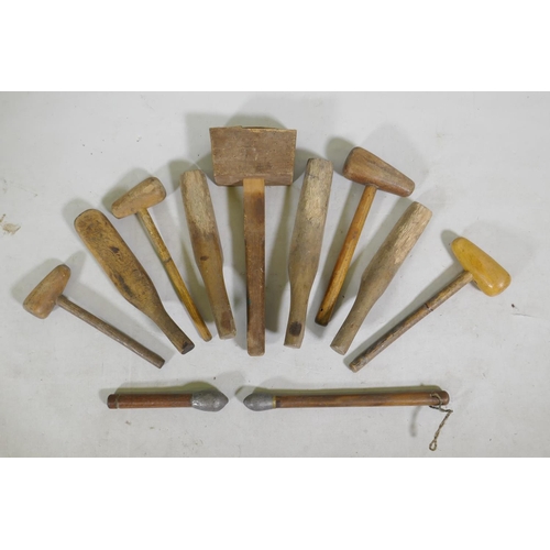 224 - A quantity of vintage wood lead beaters and mallets, largest 45cm long