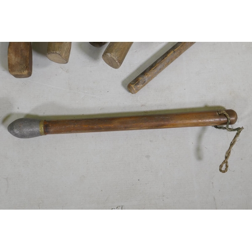 224 - A quantity of vintage wood lead beaters and mallets, largest 45cm long