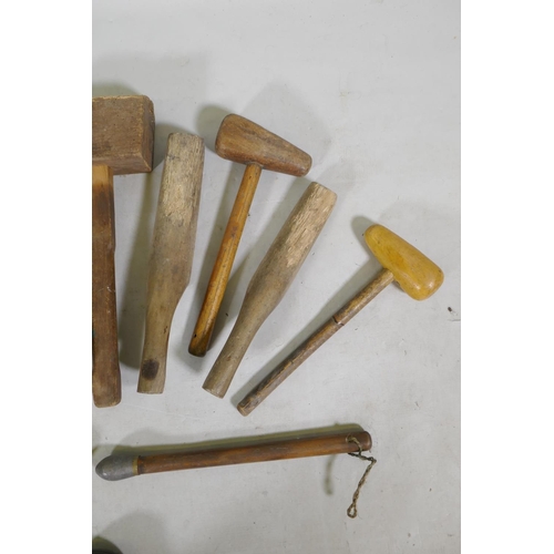 224 - A quantity of vintage wood lead beaters and mallets, largest 45cm long