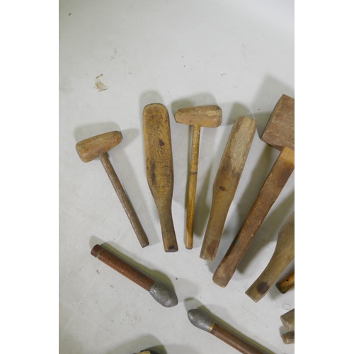 224 - A quantity of vintage wood lead beaters and mallets, largest 45cm long