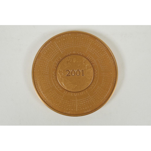 229 - A Franklin Mint solid bronze commemorative medallion/2001 year calendar, 7.5cm diameter