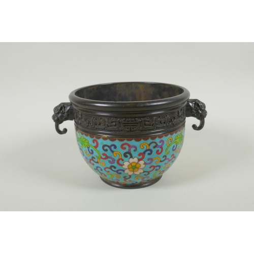 230 - A Chinese bronze two handled censer with cloisonne lotus flower decoration, impressed seal marks to ... 