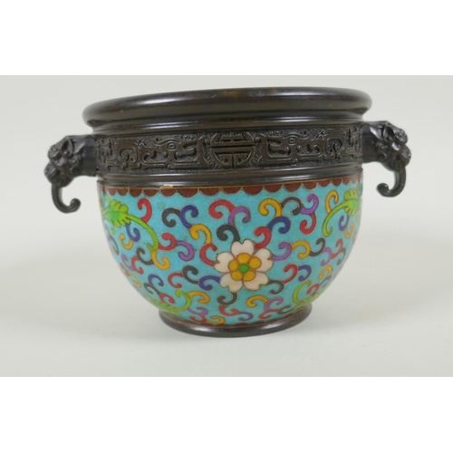 230 - A Chinese bronze two handled censer with cloisonne lotus flower decoration, impressed seal marks to ... 