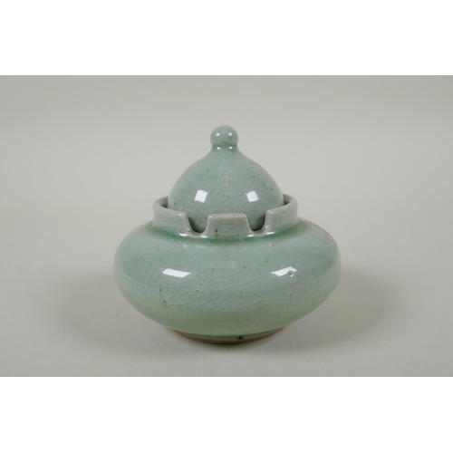 231 - A Chinese celadon crackle glazed porcelain censer and cover, 11cm diameter