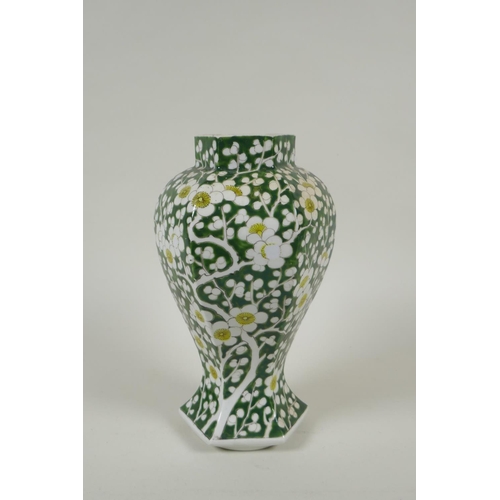 233 - An antique Chinese green ground porcelain baluster vase of hexagonal form, with allover prunus bloss... 