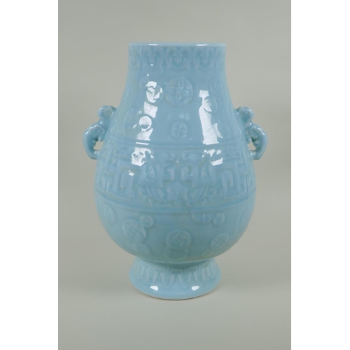 235 - A Chinese celadon ground porcelain two handled vase with underglaze archaic style decoration, 35cm h... 