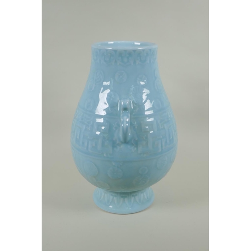 235 - A Chinese celadon ground porcelain two handled vase with underglaze archaic style decoration, 35cm h... 