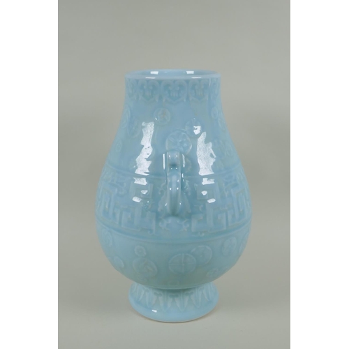 235 - A Chinese celadon ground porcelain two handled vase with underglaze archaic style decoration, 35cm h... 