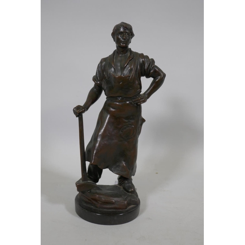 239 - Antique bronze figure of a blacksmith with hammer, unsigned, on a slate base, 26cm high