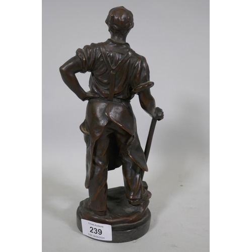 239 - Antique bronze figure of a blacksmith with hammer, unsigned, on a slate base, 26cm high