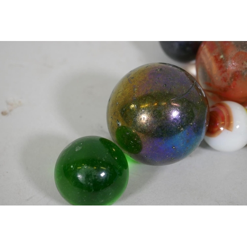 240 - A quantity of large vintage marbles with speckled and lustre finish, largest 4cm diameter