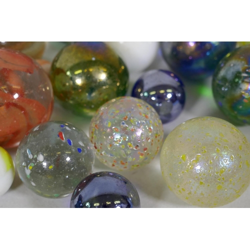 240 - A quantity of large vintage marbles with speckled and lustre finish, largest 4cm diameter