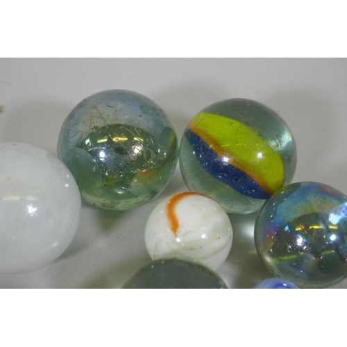 240 - A quantity of large vintage marbles with speckled and lustre finish, largest 4cm diameter