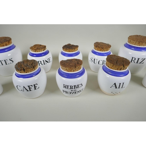 243 - Ten French ceramic blue and white storage pots and bottles with cork lids, largest 17cm  high