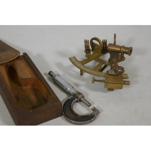 244 - A brass sextant and engineers gauge by Moore and Wright, 14cm long