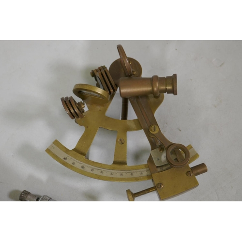 244 - A brass sextant and engineers gauge by Moore and Wright, 14cm long