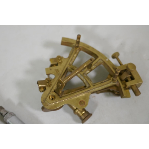 244 - A brass sextant and engineers gauge by Moore and Wright, 14cm long