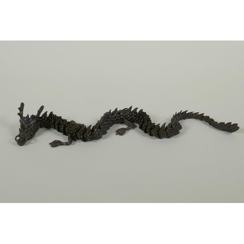 246 - A Japanese Jizai style bronze okimono dragon, 40cm long