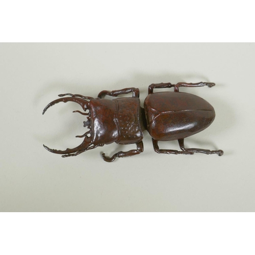 250 - A Japanese style bronze okimono stag beetle, 11cm long