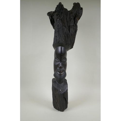 253 - An African carved iron wood head bust, 72cm high