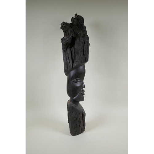 253 - An African carved iron wood head bust, 72cm high