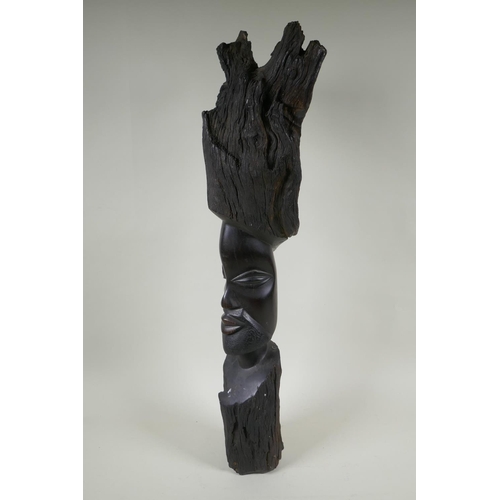 253 - An African carved iron wood head bust, 72cm high