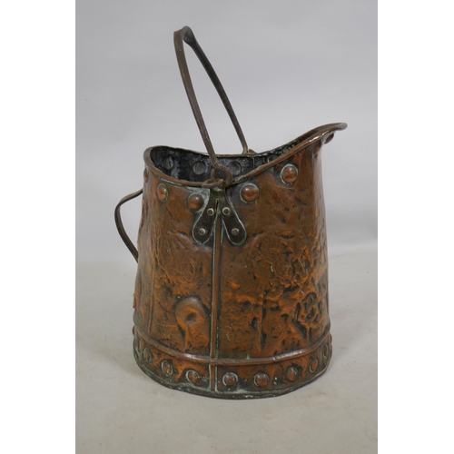 254 - An antique Arts & Crafts copper coal scuttle, 38cm high