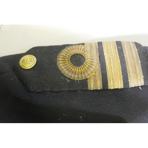 259 - A Royal Navy officer's great coat, 126cm long, and dress tunic, 90cm long