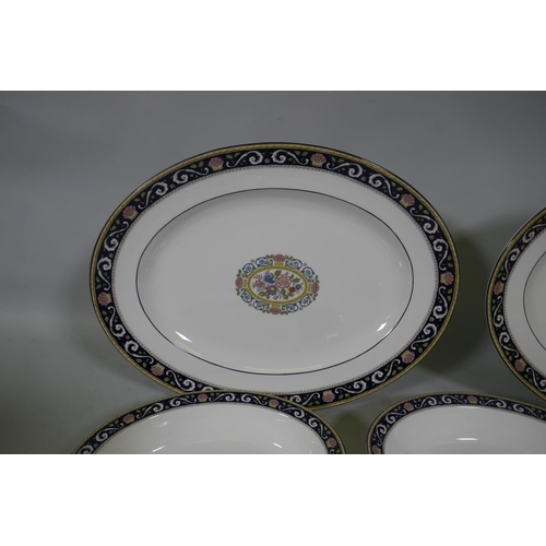 263 - A Wedgwood Runnymede part dinner service, to include oval serving plates and bowls, a gravy boat, cu... 