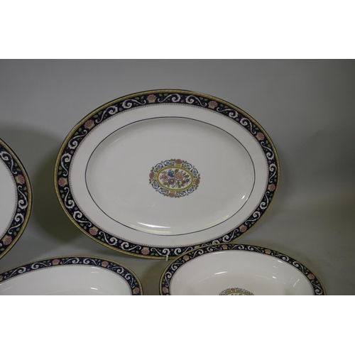 263 - A Wedgwood Runnymede part dinner service, to include oval serving plates and bowls, a gravy boat, cu... 