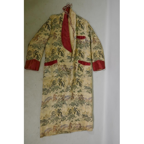 264 - A vintage Oriental embroidered silk gown, 143cm