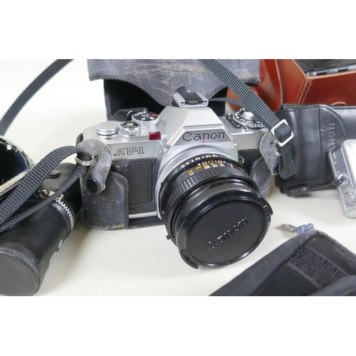 274 - A quantity of vintage 35mm and medium format cameras and accessories, to include a Canon AV-1, a Lub... 