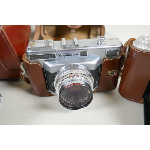 274 - A quantity of vintage 35mm and medium format cameras and accessories, to include a Canon AV-1, a Lub... 