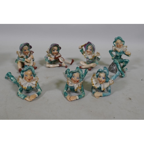 283 - A set of seven porcelain pixies, mid C20th, made in occupied Japan stamp, 9cm high