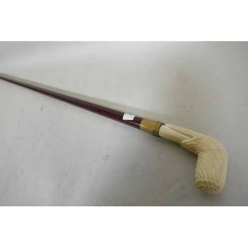 284 - A hardwood walking cane with ivorine handle, 96cm long