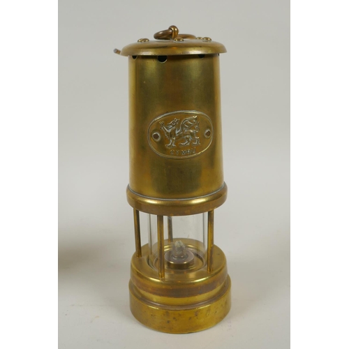 288 - A Welsh brass miner's lamp by Vale Metal Spinners Hirwaun, and a Lamp & Limelight Co miner's lam... 