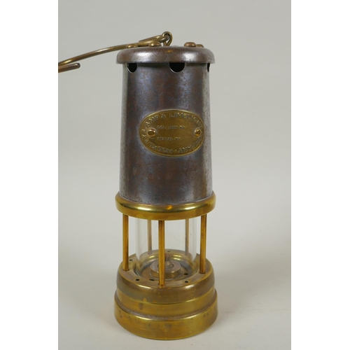 288 - A Welsh brass miner's lamp by Vale Metal Spinners Hirwaun, and a Lamp & Limelight Co miner's lam... 