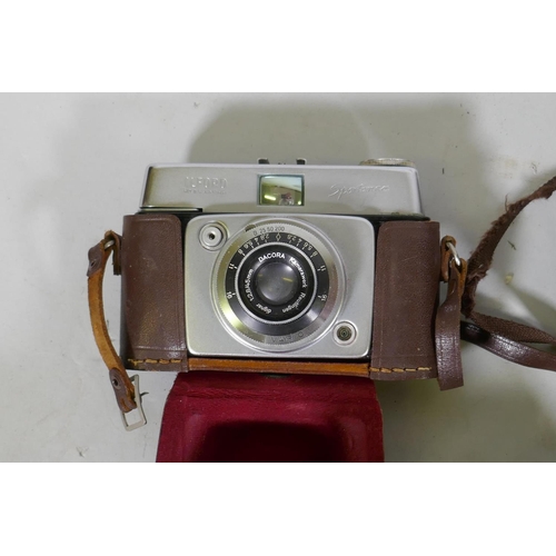 291 - A collection of vintage 35mm cameras, Pentax, Kodak Pony 135, Olympus Pen, flashlights, video proces... 