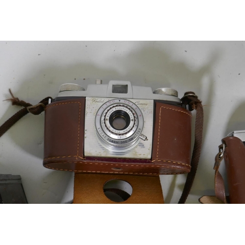 291 - A collection of vintage 35mm cameras, Pentax, Kodak Pony 135, Olympus Pen, flashlights, video proces... 