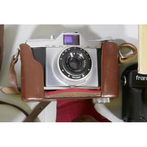 291 - A collection of vintage 35mm cameras, Pentax, Kodak Pony 135, Olympus Pen, flashlights, video proces... 