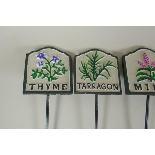 292 - Ten painted cast metal herb markers, 28cm