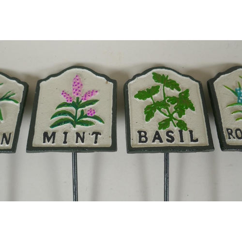 292 - Ten painted cast metal herb markers, 28cm