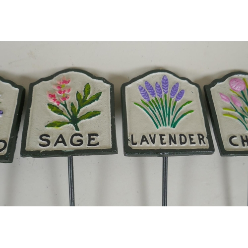 292 - Ten painted cast metal herb markers, 28cm