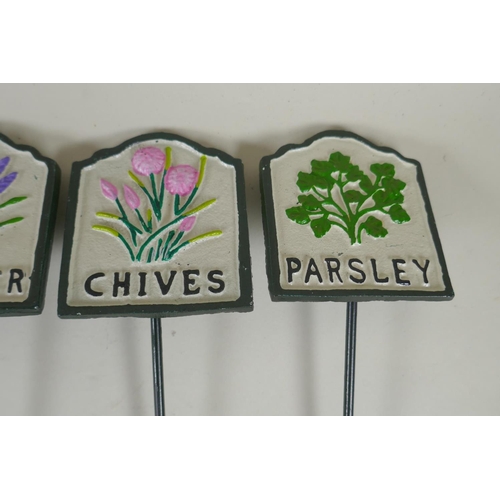 292 - Ten painted cast metal herb markers, 28cm