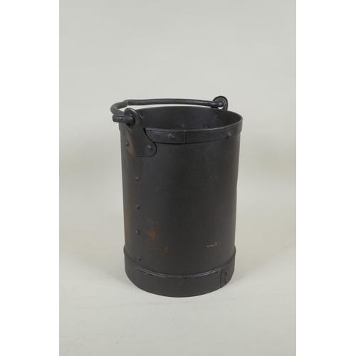 299 - A riveted metal pail, 26cm high x 18cm diameter