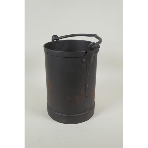 299 - A riveted metal pail, 26cm high x 18cm diameter