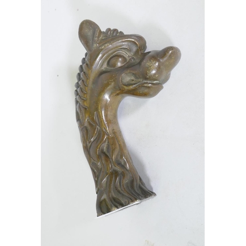 321 - Antique bronze mount in the form of a dragon's head, 17cm long